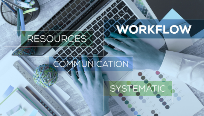 Workflow related words floating over a laptop.